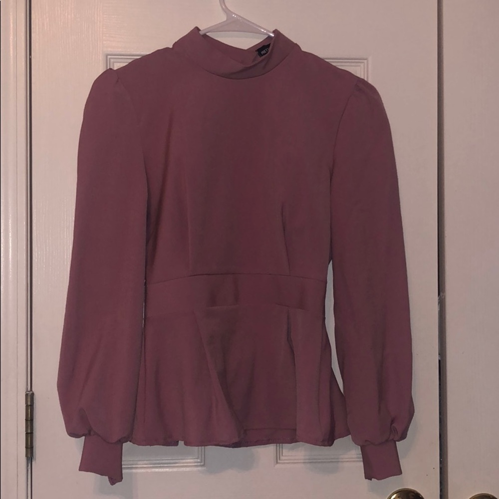 High neck open back balloon sleeve blouse.